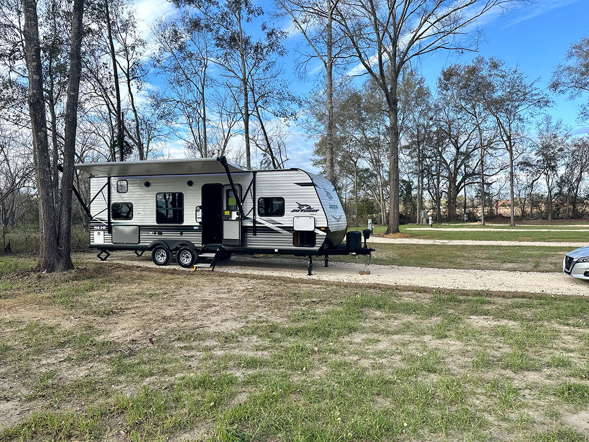 view of an rv sitting on one of the spots at the park